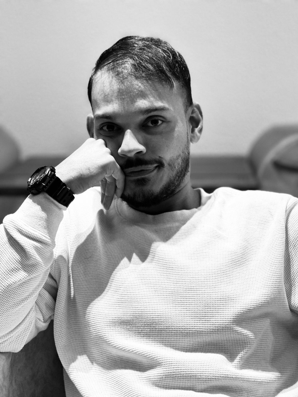 Rabiham — black and white portrait, resting his chin on his hand